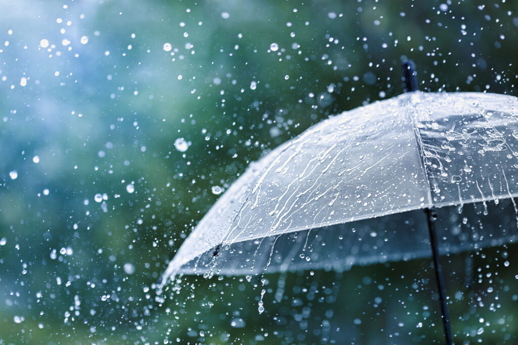 An umbrella under heavy rain