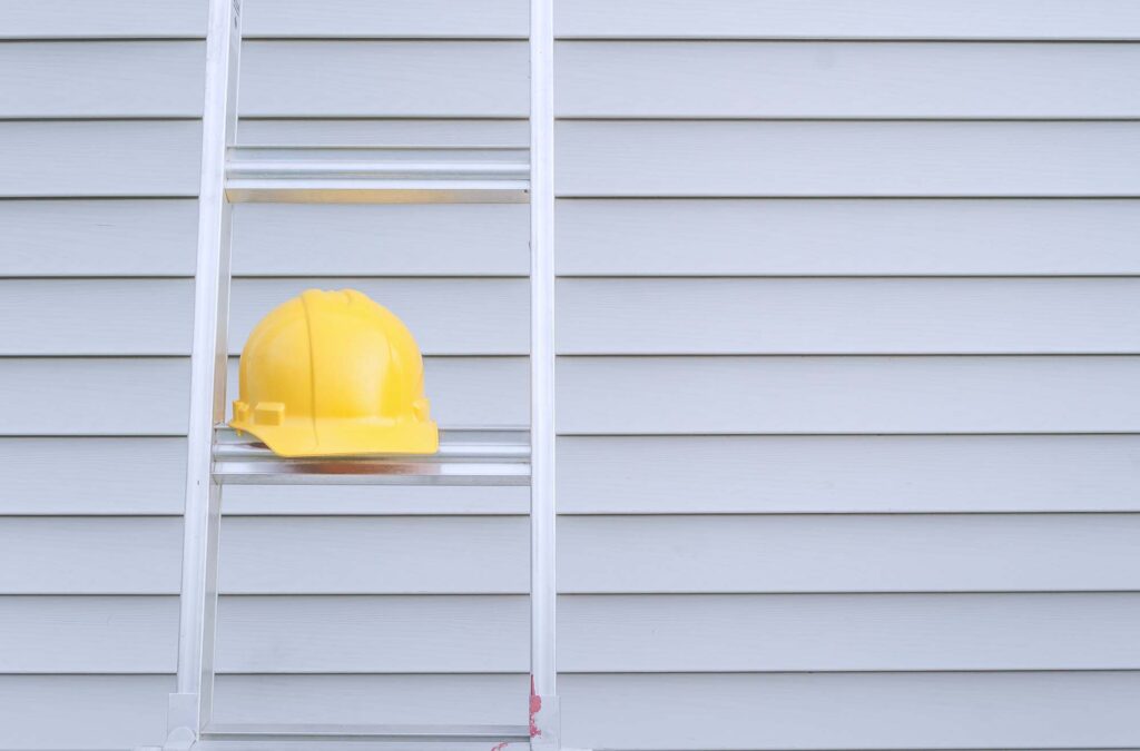 Yellow helmet on a ladder