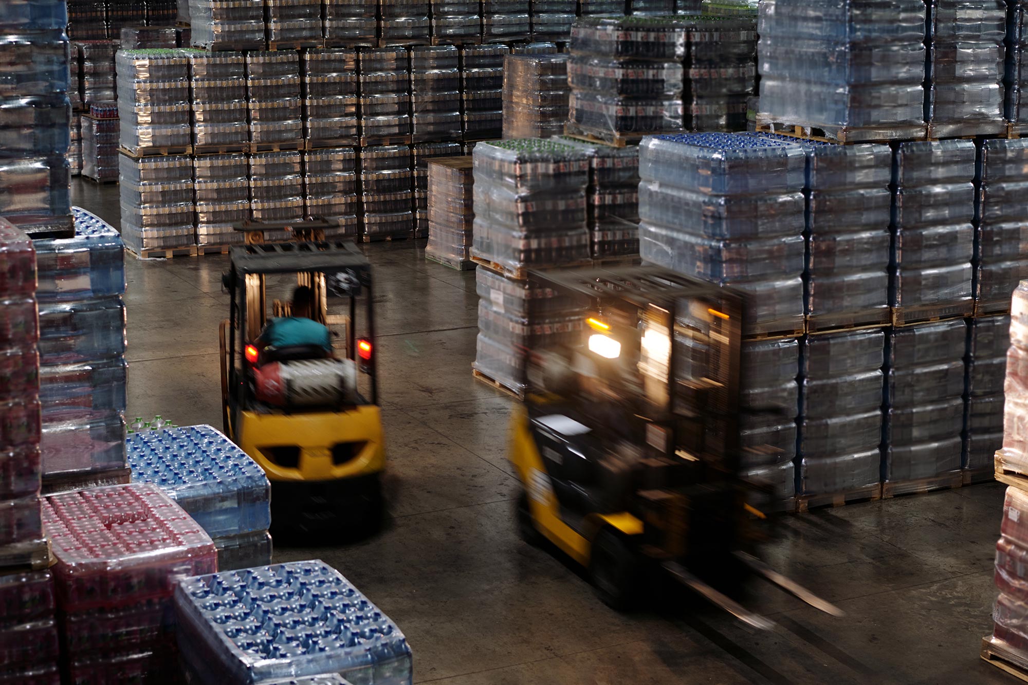 Blurry motion of forklifts in a beverage warehouse