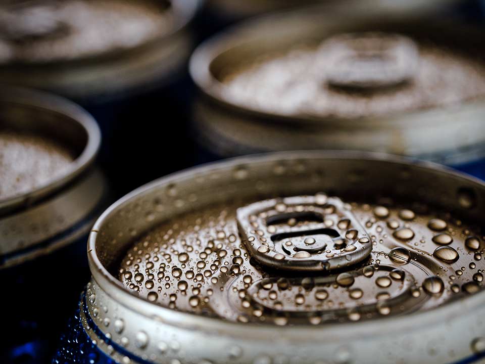 Can of beverage with condensation visible