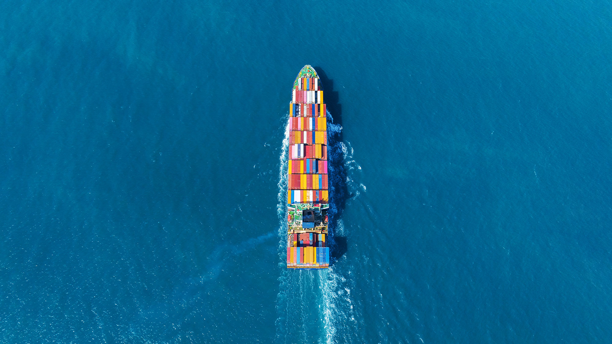 Container ship carrying cargo in the ocean